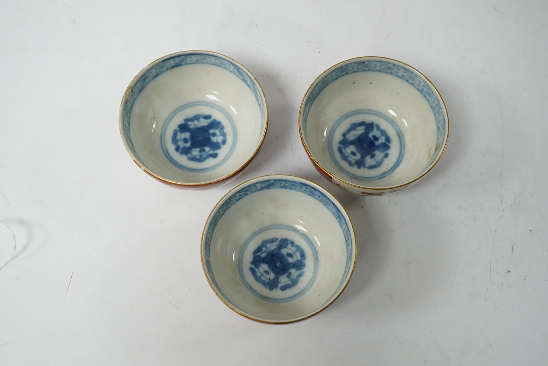 Three Imari ‘Black Ship’ teabowls, Meiji period, 8.5cm in diameter. Condition - good